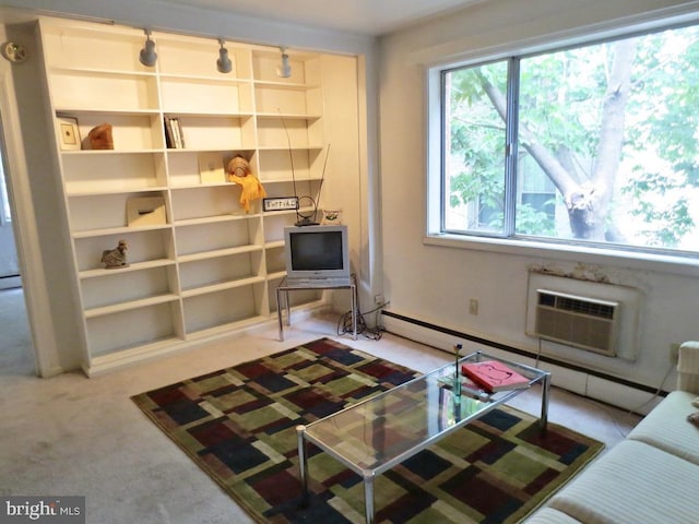 interior space with carpet flooring and a wall mounted AC