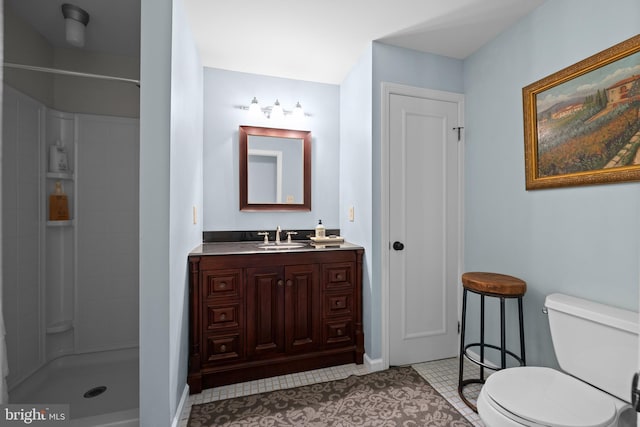 bathroom featuring tile patterned floors, vanity, toilet, and walk in shower