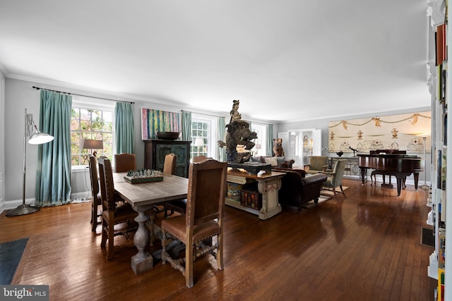 dining space with crown molding and dark hardwood / wood-style floors