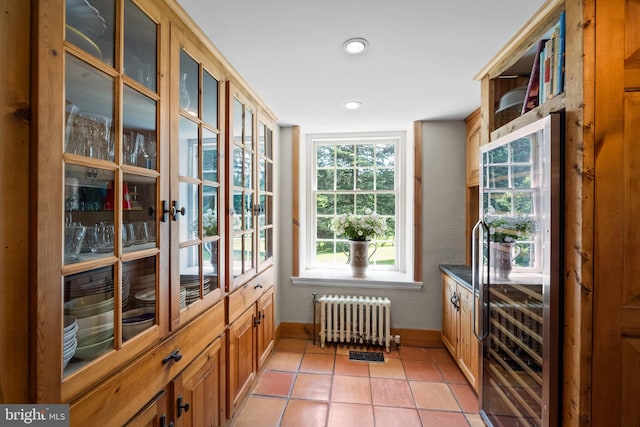 interior space featuring radiator heating unit and wine cooler