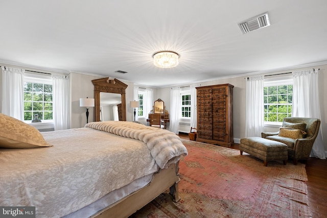 bedroom with hardwood / wood-style floors