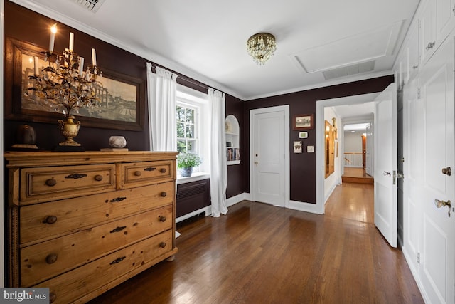 foyer entrance featuring radiator heating unit, dark hardwood / wood-style floors, french doors, and crown molding