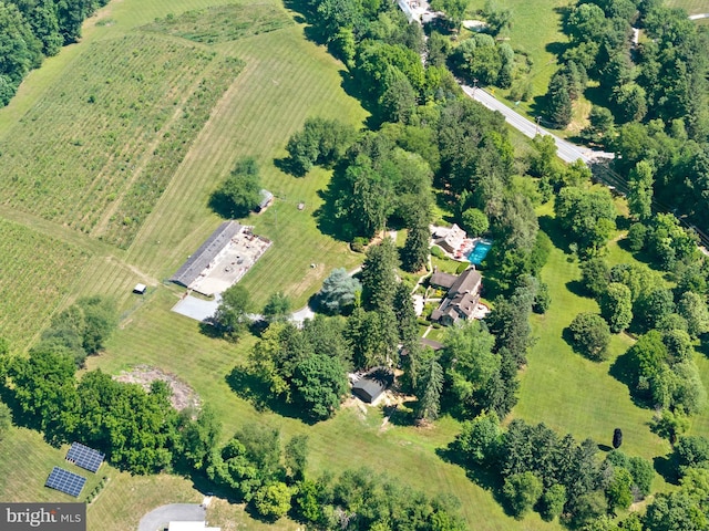 birds eye view of property with a rural view