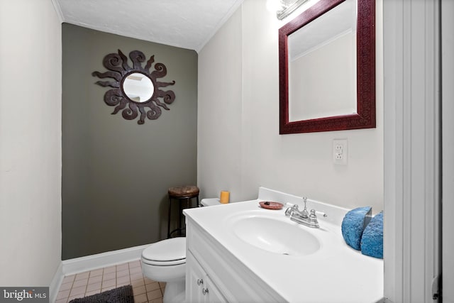 bathroom with tile patterned floors, vanity, and toilet