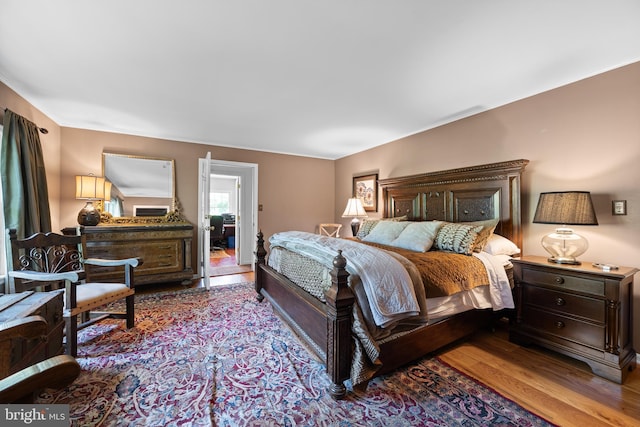 bedroom with hardwood / wood-style floors