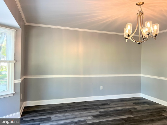 unfurnished room featuring ornamental molding, dark wood-type flooring, and a chandelier