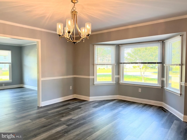 unfurnished room with dark hardwood / wood-style flooring, an inviting chandelier, and ornamental molding