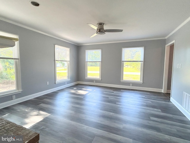 unfurnished room featuring crown molding, ceiling fan, and dark wood-type flooring