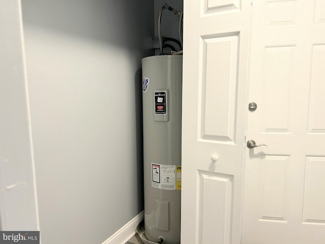 utility room featuring electric water heater