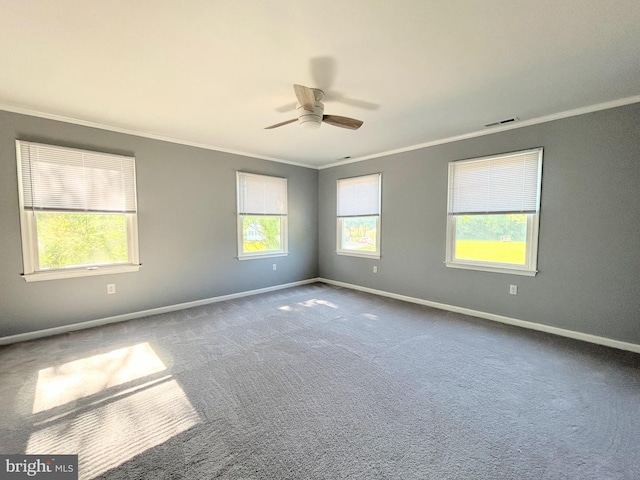 empty room with carpet, ceiling fan, and crown molding