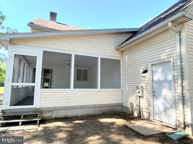 exterior space featuring a sunroom