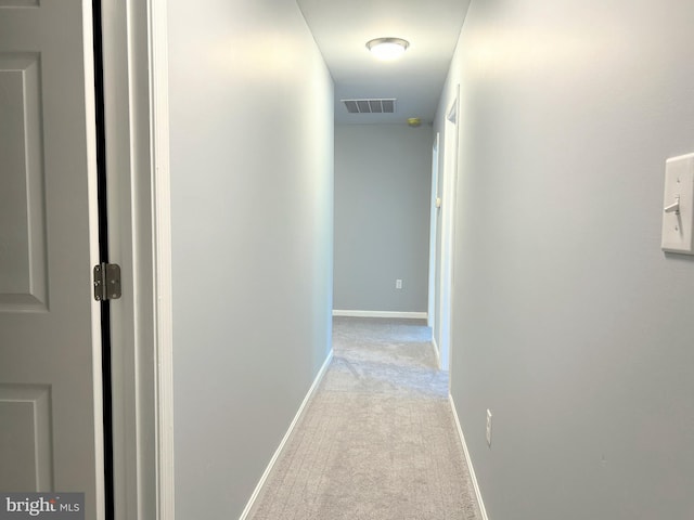 hallway with light carpet