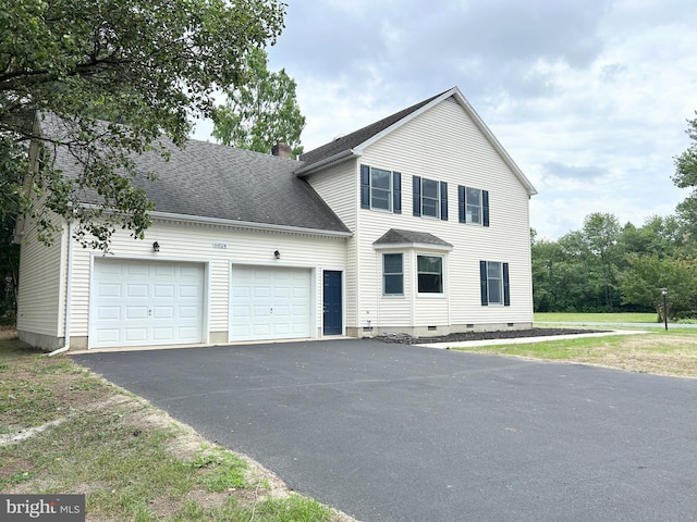 view of front of home with a garage