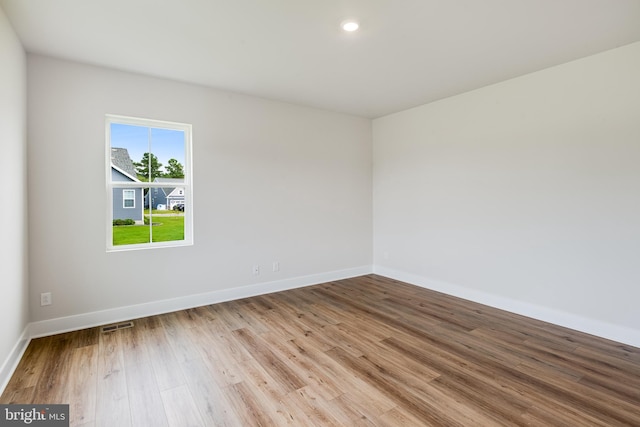 unfurnished room featuring light hardwood / wood-style flooring