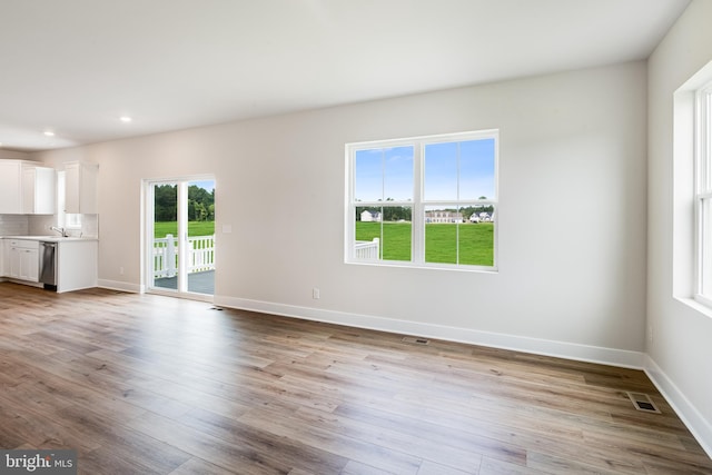 unfurnished living room with light hardwood / wood-style floors