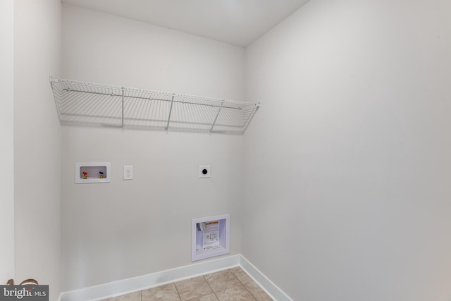 laundry room featuring washer hookup, hookup for an electric dryer, and light tile patterned flooring