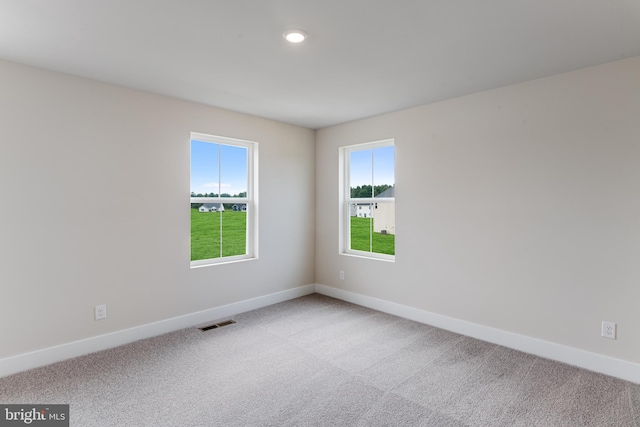 empty room with carpet flooring