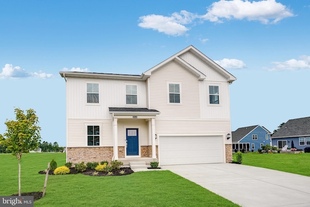 view of front facade with a front yard and a garage