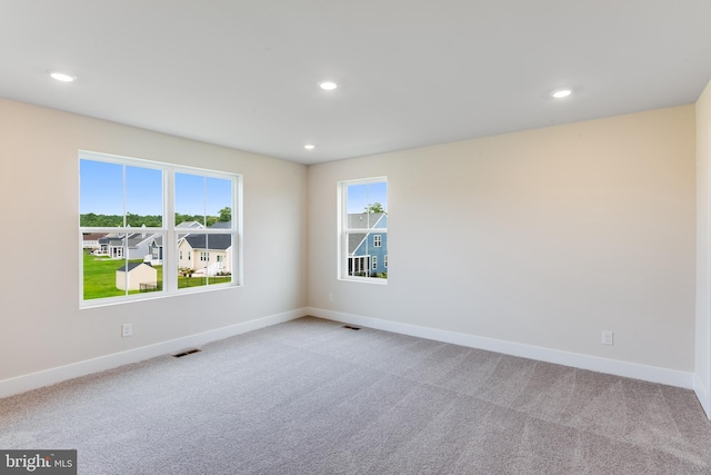 empty room featuring light carpet