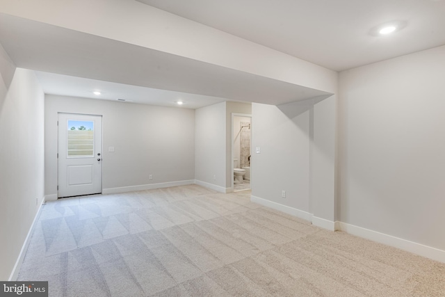 basement with light carpet