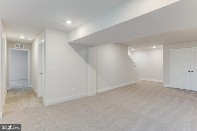 basement with light colored carpet