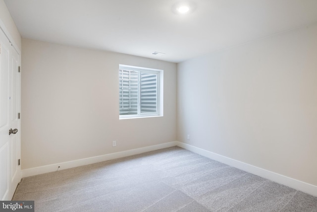 empty room with light colored carpet