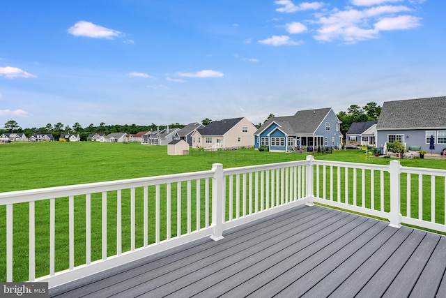 wooden deck with a lawn