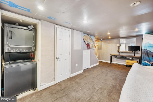 interior space with carpet flooring and stacked washer and dryer