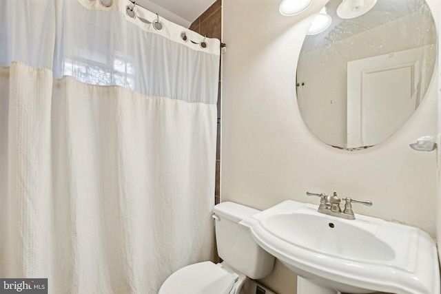 bathroom with toilet and sink