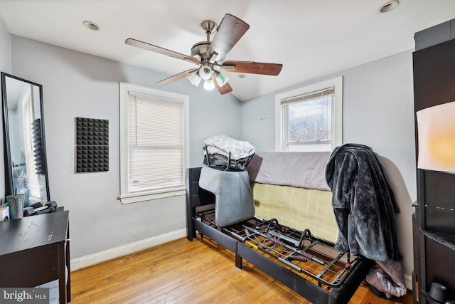 bedroom featuring ceiling fan and light hardwood / wood-style flooring