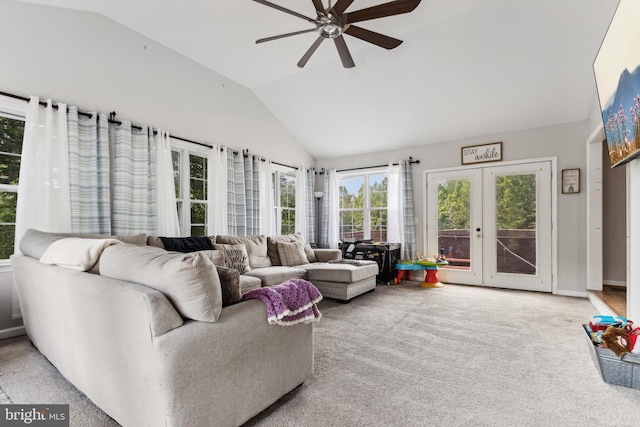 carpeted living room featuring ceiling fan, french doors, and lofted ceiling