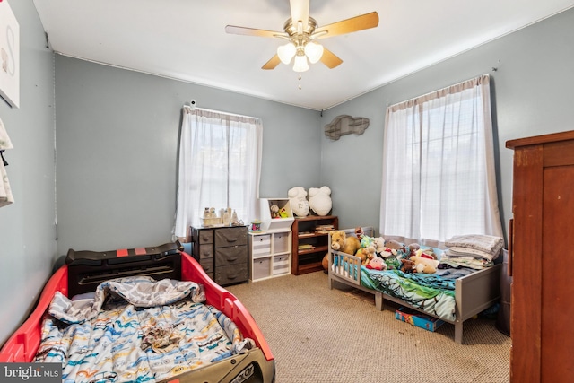 carpeted bedroom with ceiling fan