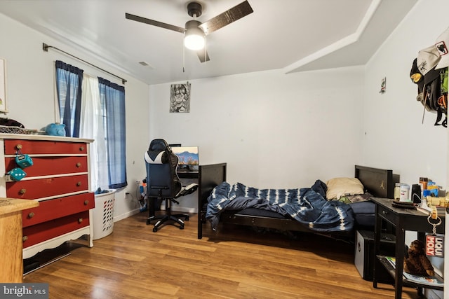 bedroom featuring hardwood / wood-style floors and ceiling fan