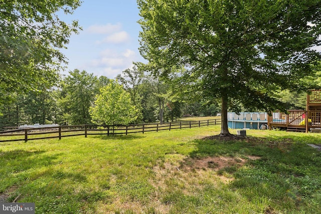 view of yard featuring a wooden deck