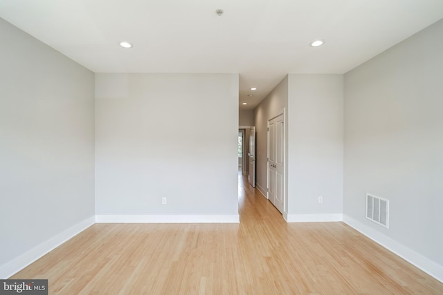 unfurnished room with light hardwood / wood-style floors