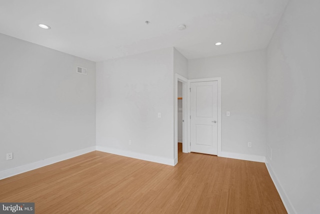 empty room with light hardwood / wood-style floors