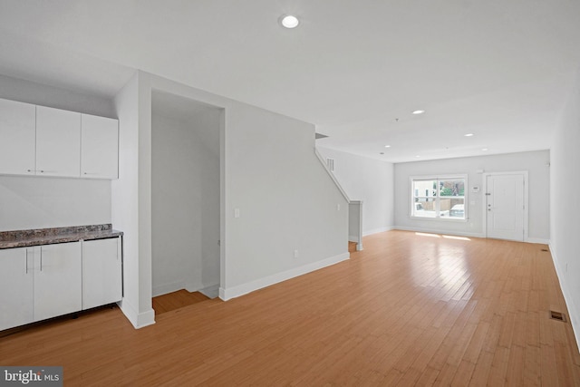 unfurnished living room with light hardwood / wood-style flooring