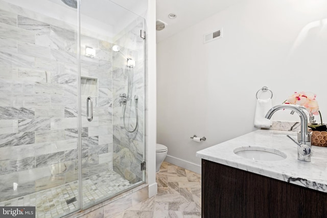 bathroom featuring vanity and an enclosed shower