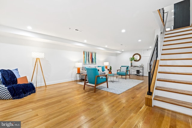 living room with light hardwood / wood-style flooring