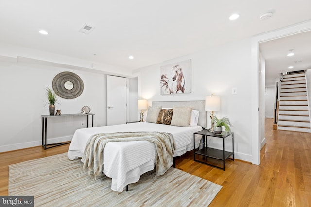 bedroom featuring wood-type flooring