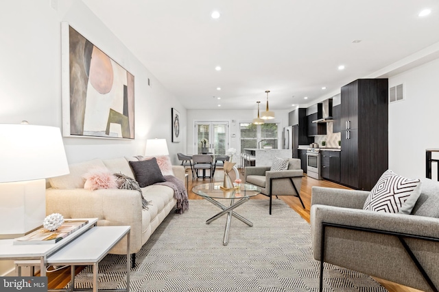 living room with light hardwood / wood-style floors