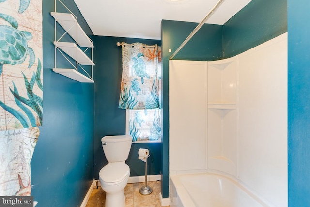 bathroom with tile patterned floors, toilet, and shower / bathing tub combination