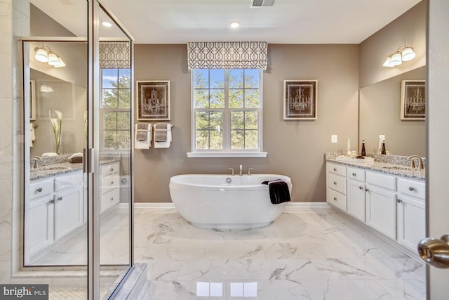 bathroom with plus walk in shower and vanity