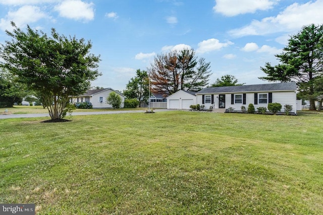 view of yard with a garage and an outdoor structure