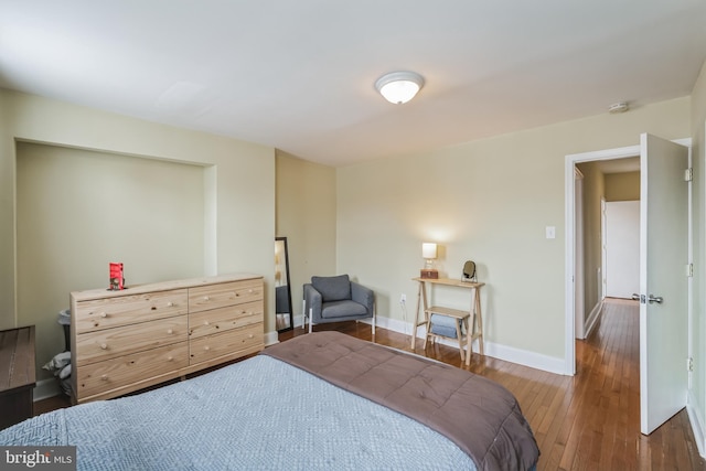 bedroom featuring dark hardwood / wood-style floors