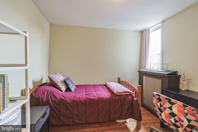 bedroom featuring dark hardwood / wood-style floors