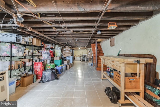 basement with light tile patterned flooring