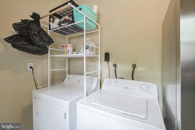 laundry room with independent washer and dryer