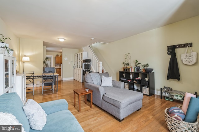 living room with light hardwood / wood-style flooring