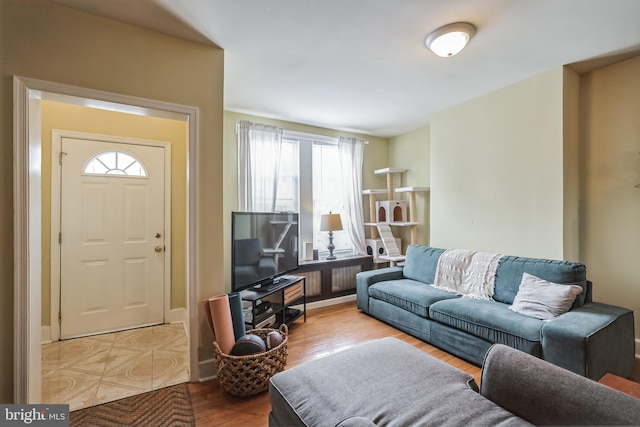 living room with a wealth of natural light and hardwood / wood-style floors